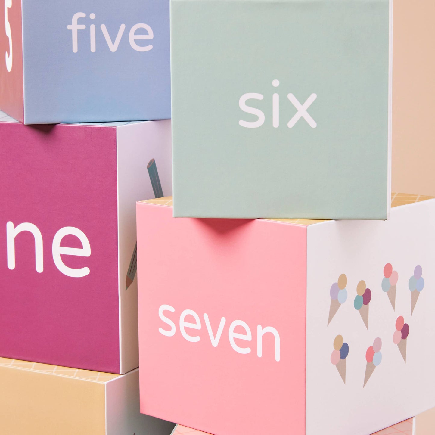 Colorful boxes with numbers and ice cream illustrations on a light background