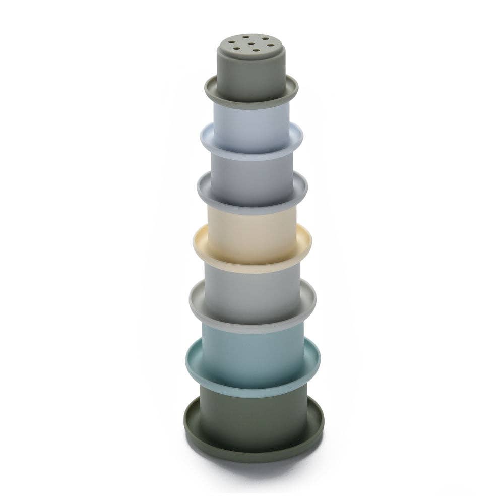 Stack of blue silicone stacking cups on a white background