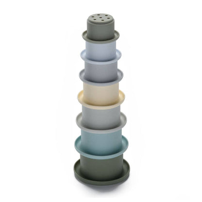 Stack of blue silicone stacking cups on a white background