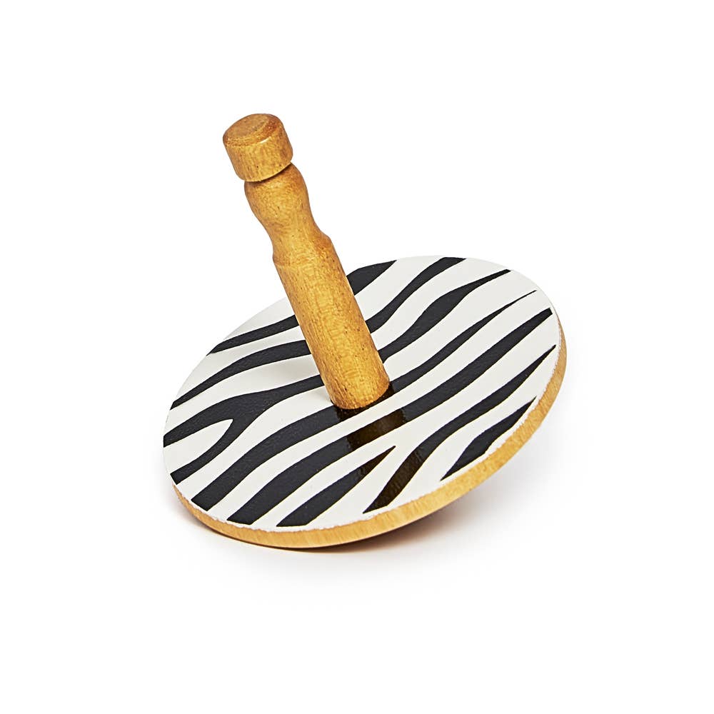Wooden toy with zebra-patterned top on a white background