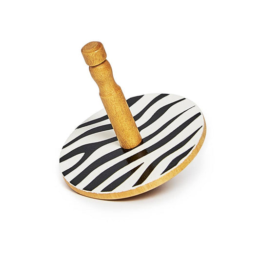 Wooden toy with zebra-patterned top on a white background