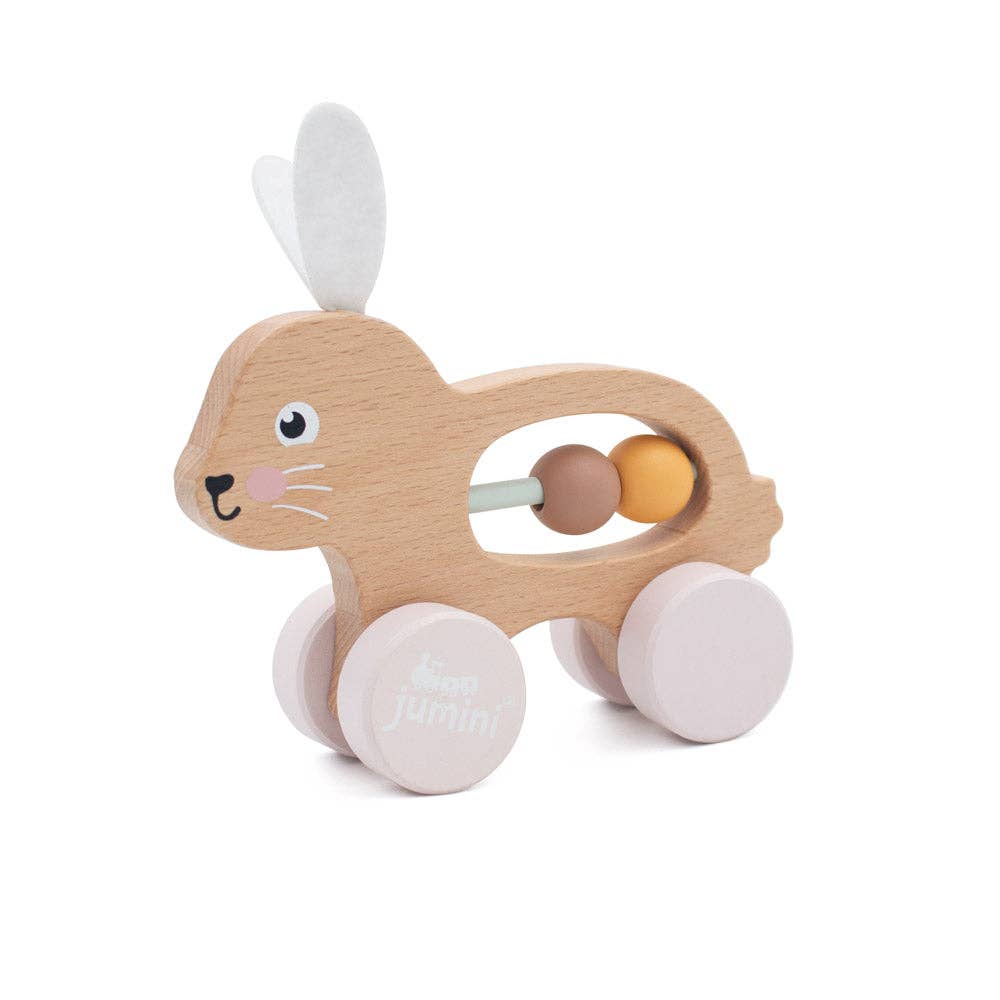 Wooden toy rabbit with wheels and beads on a white background