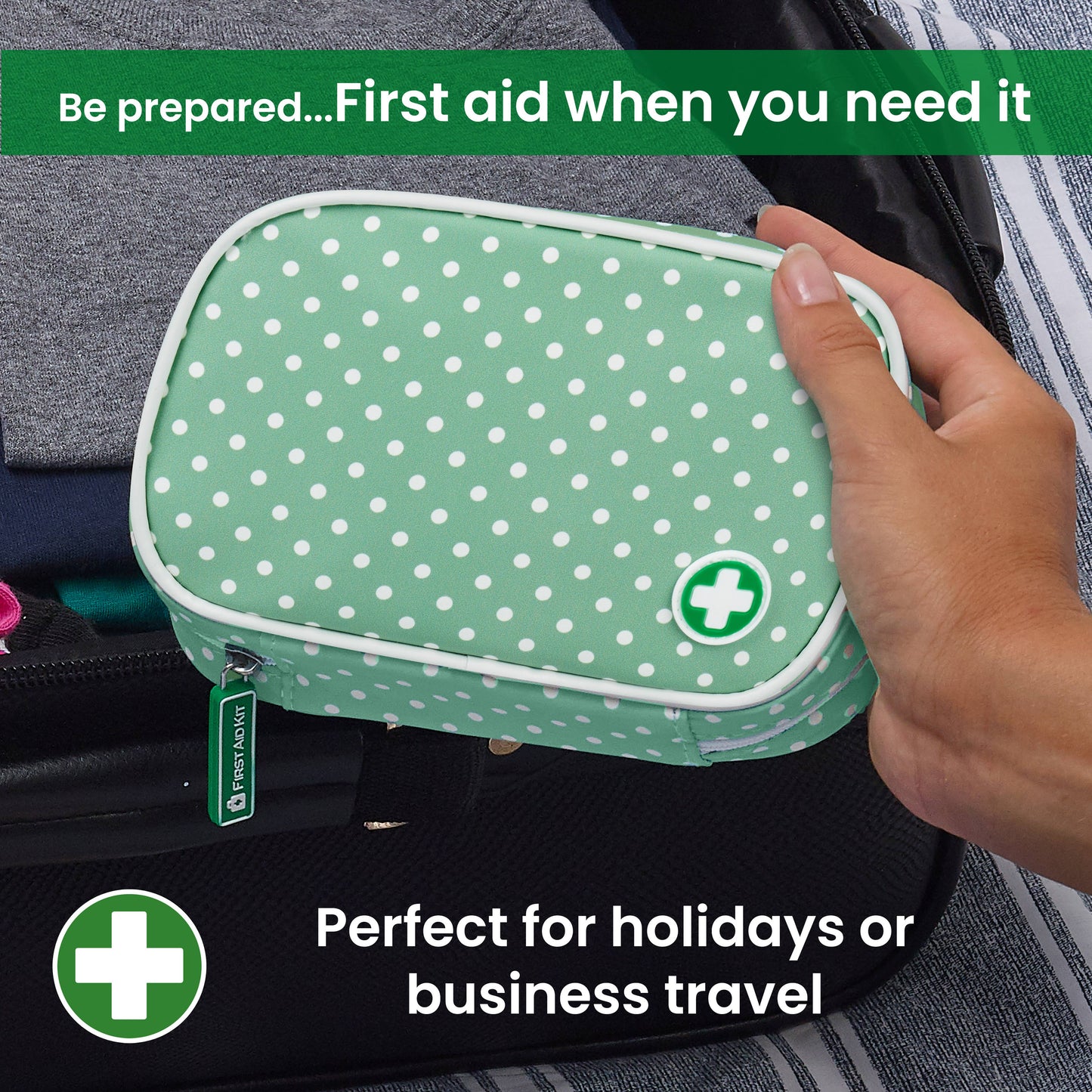 Green polka dot first aid kit held by a hand with text about its use for holidays or business travel.