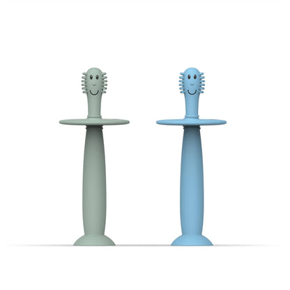 Two children's toothbrushes with smiling heads on a white background