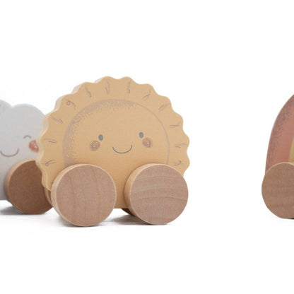 Wooden toy sun with wheels on a white background