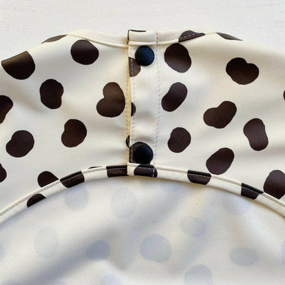 Close-up of a polka dot pattern on a white background