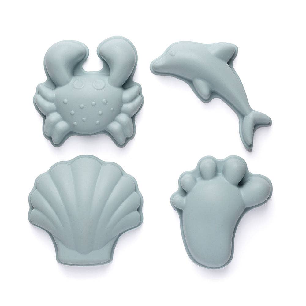 Set of four silicone molds shaped like a crab, dolphin, shell, and footprint on a white background.