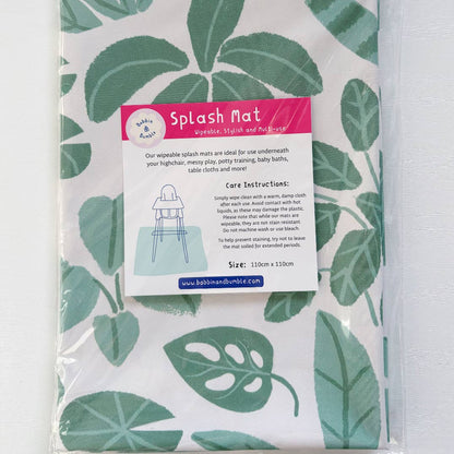 Packaged splash mat with leaf pattern and product details on a white background