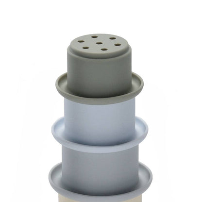 Grey silicone stacking cups on a white background
