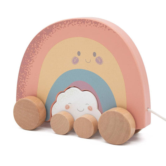 Toy rainbow with wheels on a white background