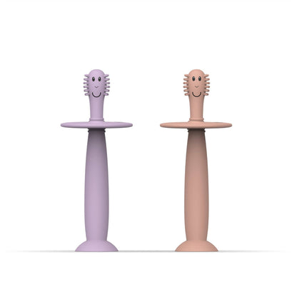 Two children's toothbrushes with smiling heads on a white background