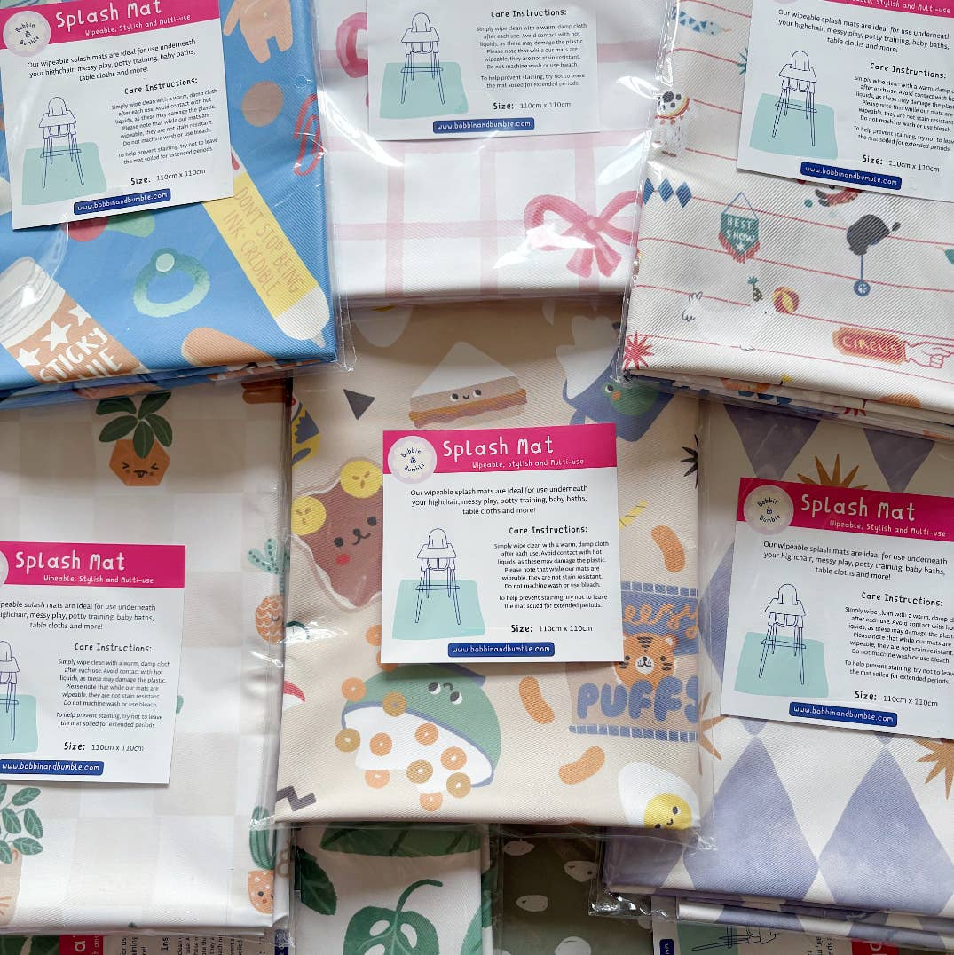 Collection of colorful splash mats with packaging and care instructions.