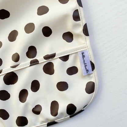 Polka dot patterned product with a visible brand label on a light gray background