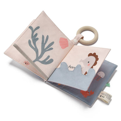 Children's soft book with illustrations of animals and a teething ring on a white background