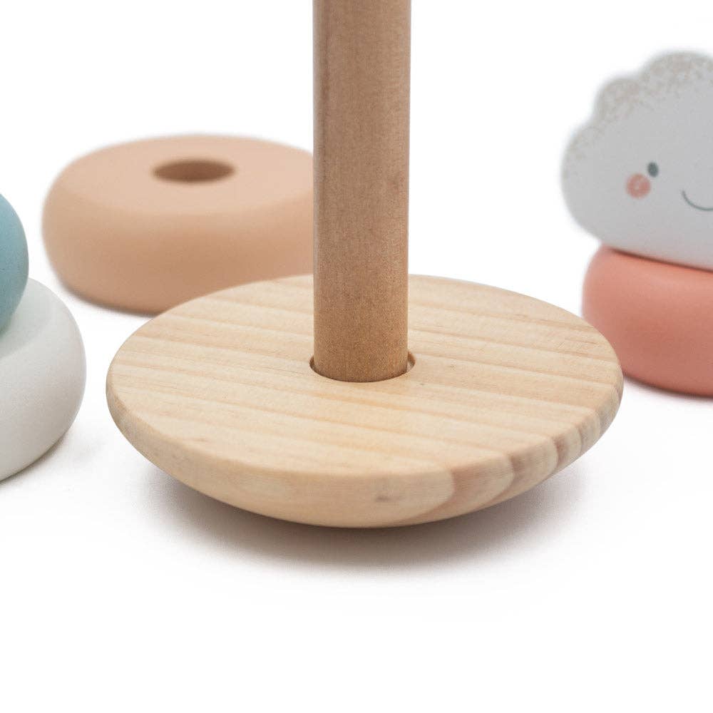 Wooden stand with colourful rings on a white background