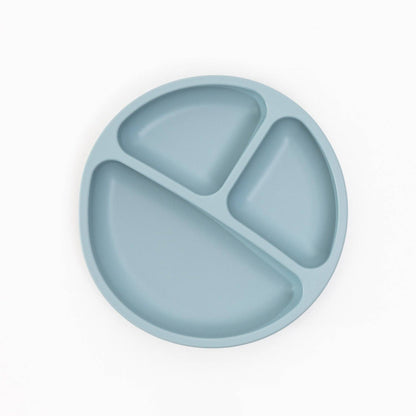 Blue silicone plate with three sections on a white background