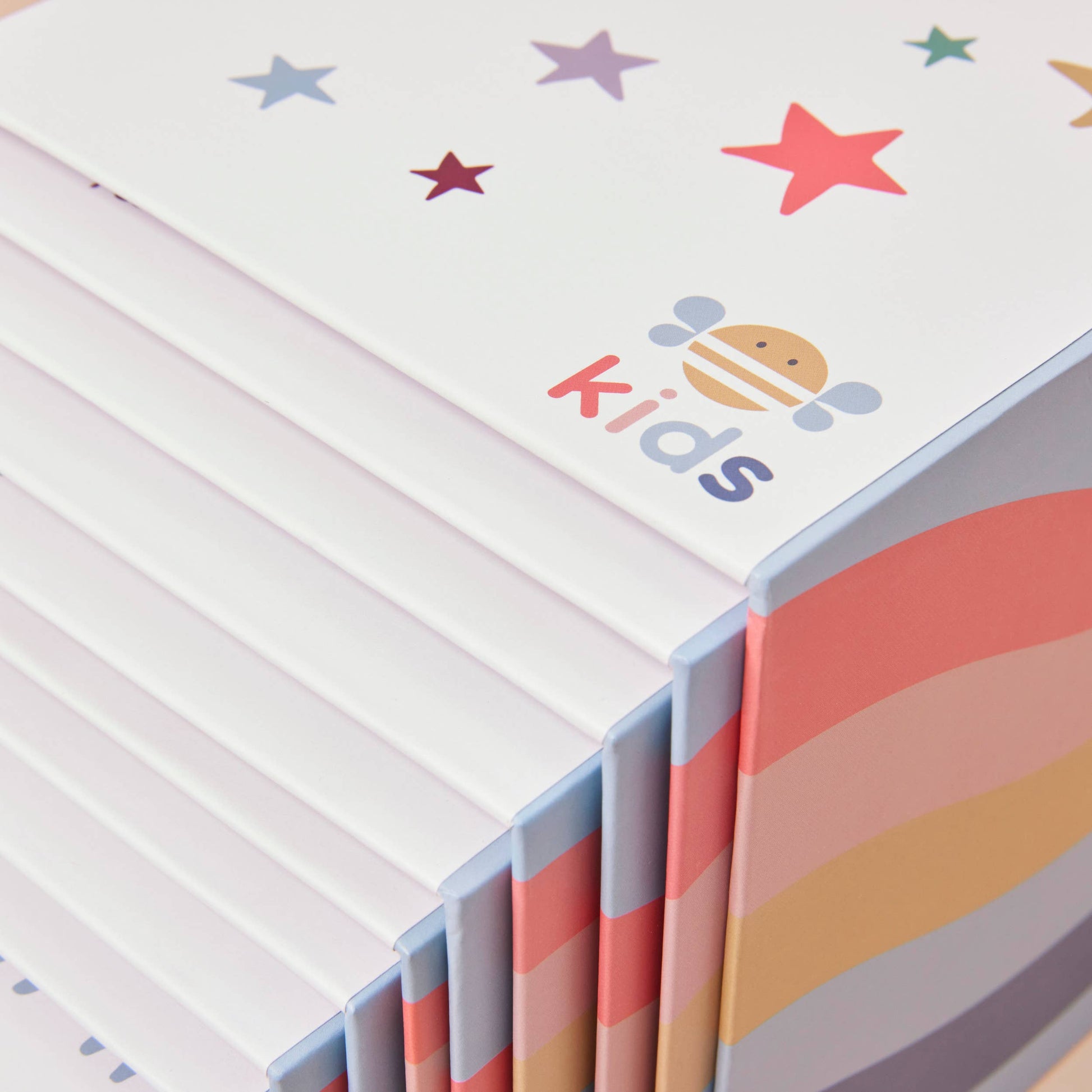 Children's stacking cubes with colourful stars and 'kids' branding on a white background