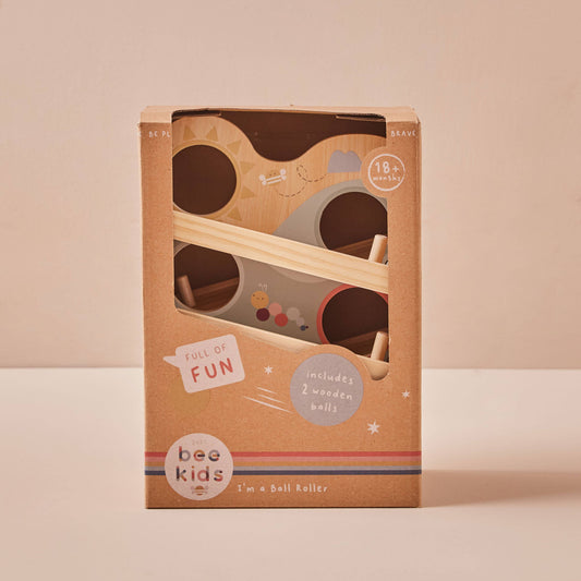 Wooden ball roller toy packaging with 'bee kids' branding on a beige background