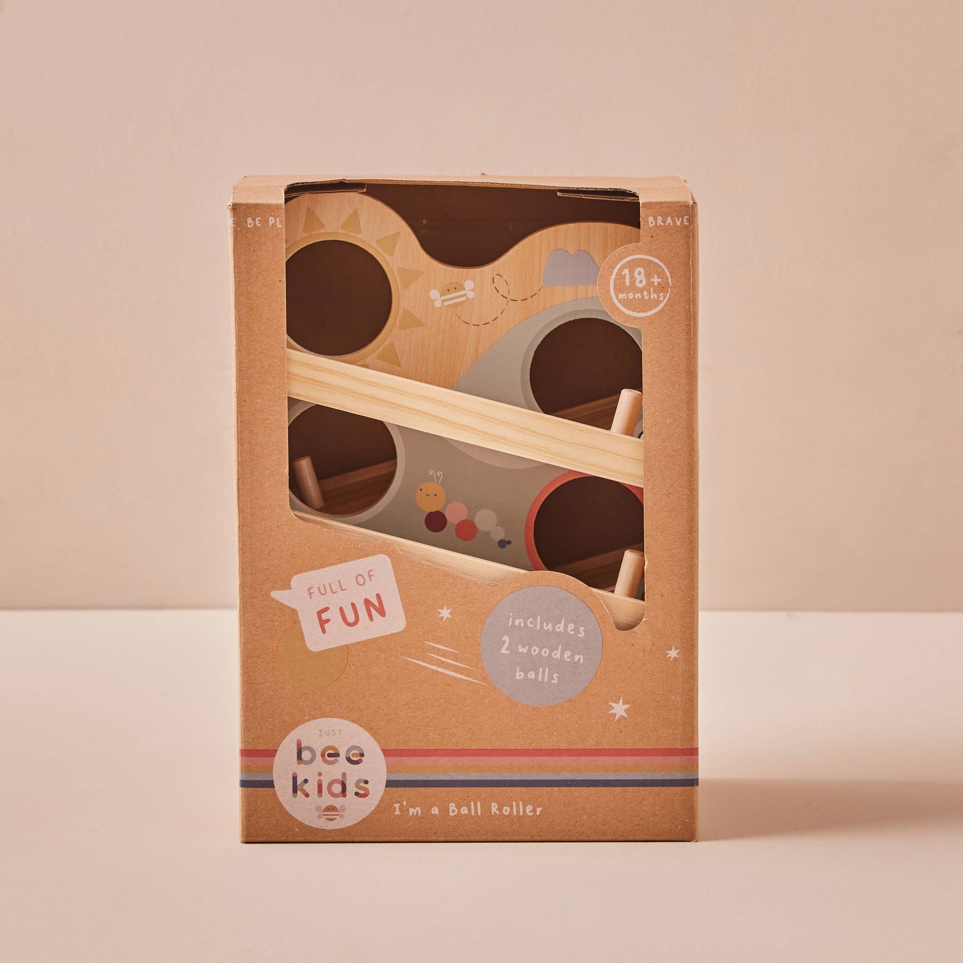 Wooden ball roller toy packaging with 'bee kids' branding on a beige background