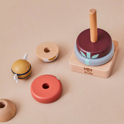Set of colorful wooden toys on a beige background