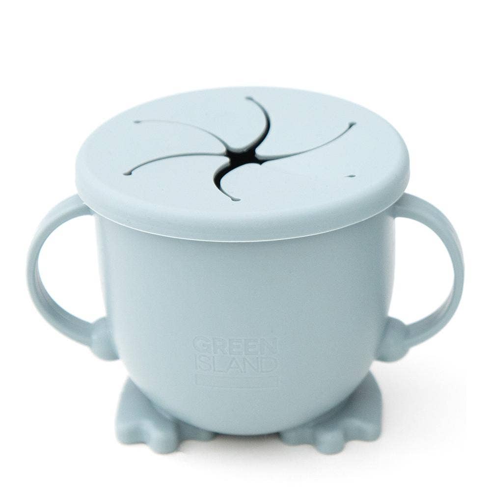 Light blue sippy cup with lid and suction cup on a white background