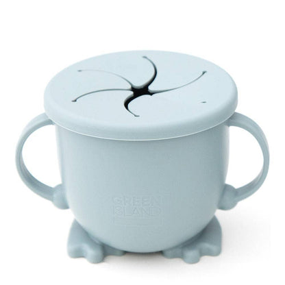 Light blue sippy cup with lid and suction cup on a white background