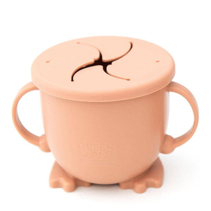 Pink sippy cup with a lid on a white background
