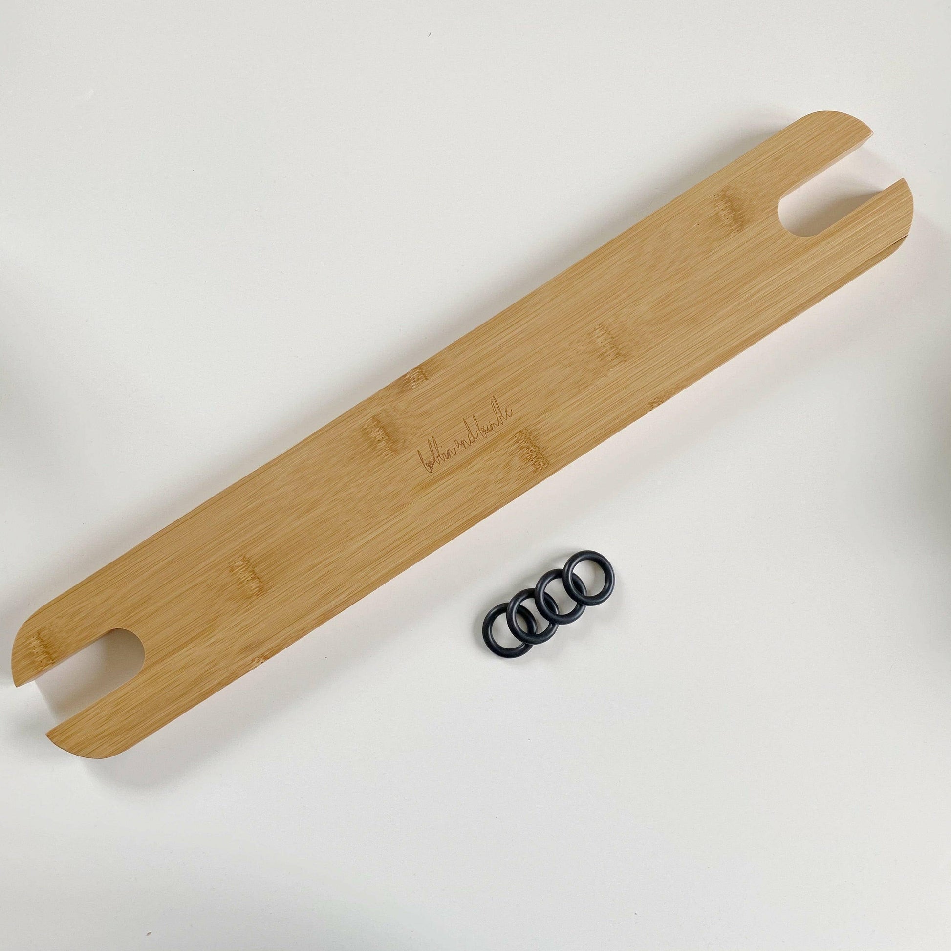 Wooden footrest with cutout handles on a white background