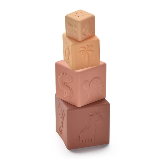 Stack of three terracotta-colored blocks with embossed designs on a white background