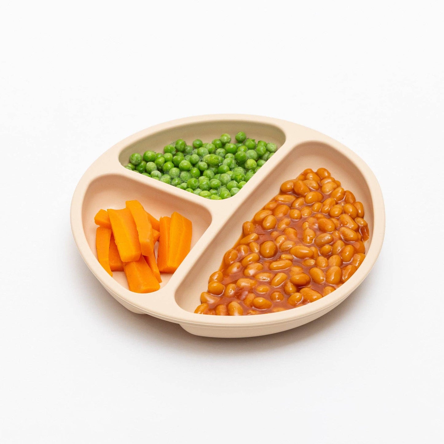 Divided plate with carrots, green peas, and beans on a white background