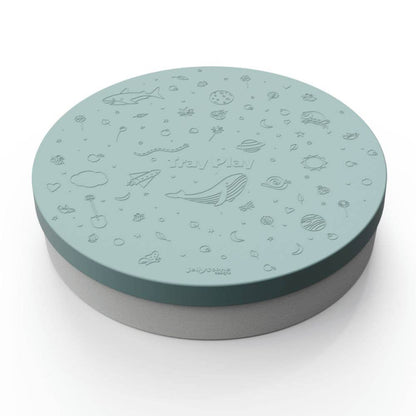 Round green and gray lid with ocean-themed design on a white background