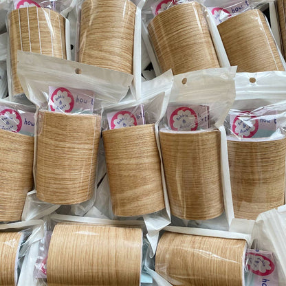 Multiple packages of wood effect vinyl leg wraps with visible brand label.